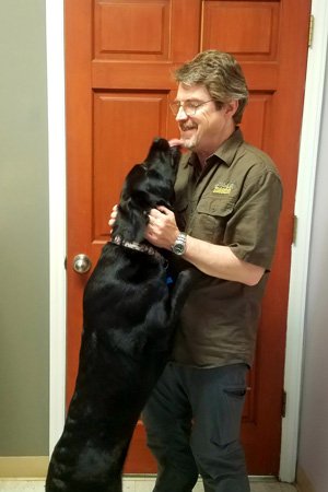 Companion Animal Clinic Veterinarian Dr. McCormick Veterinarian with Dog